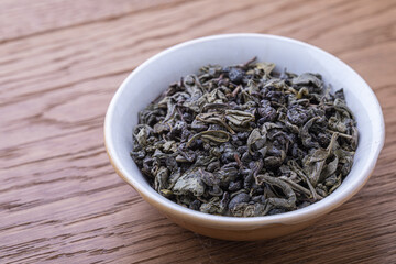 Dried natural large tea leaves close up. Tea Zhu Lu also known as Gunpowder.