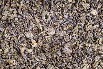 Dried natural large tea leaves close up. Tea Zhu Lu also known as Gunpowder.