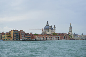 Fototapeta premium Waterfront of Guidecca canal in Venezia in stormy spring day. Venice - 4 May, 2019