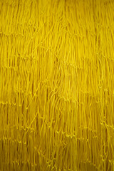 Nylon braided rope. Blue colored nylon braided rope. Fishing net knitted with nylon thread.
Yellow fishing net.