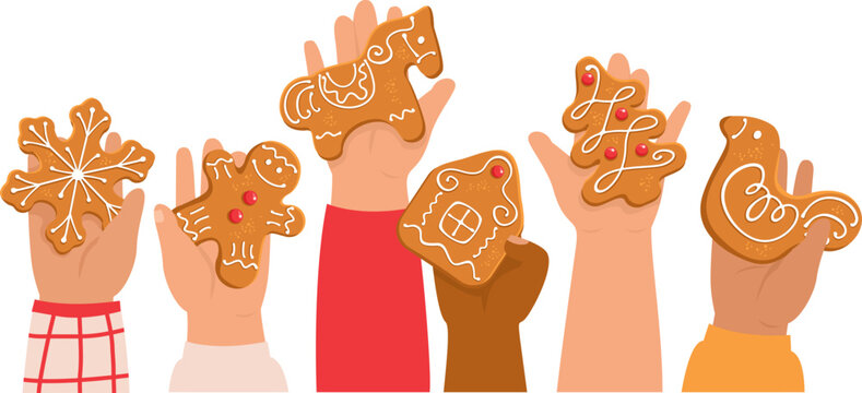 Children holding decorated gingerbreads. Kid's hands with traditional Christmas cookies