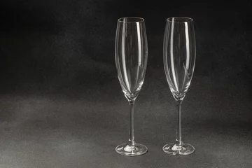 Foto op Aluminium two transparent glasses for champagne on a dark background. copy space for text © Надія Коваль