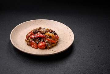 Warm salad with veal, tomatoes, peppers, zucchini, sesame, salt, spices and herbs