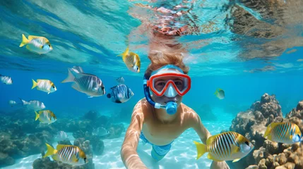 Fotobehang Child in snorkeling mask dives underwater © Cedar