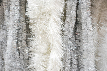 Christmas white Garlands rain Decorations background. New Year decor for the interior in the store