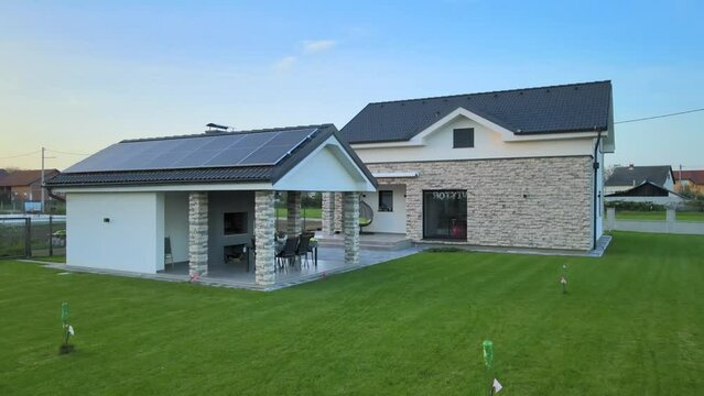 New modern home with solar panels, efficient energy saving renewable house