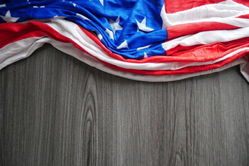 Closeup of American flag on wooden texture background