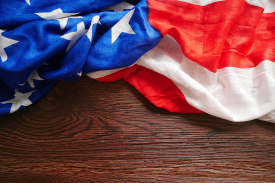 Closeup of American flag on wooden texture background