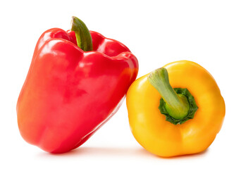 Fresh red and yellow bulgarian bell peppers isolated on white background with clipping path and shadow in png file format. Sweet paprika chili