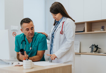 Expert Doctors Reviewing and Discussing Medical Test Results in a Hospital Clinic