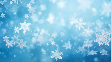 Fototapeta premium Winter background, falling beautiful snowflakes, selective focus. Falling snow and snowflakes close-up on a blue background