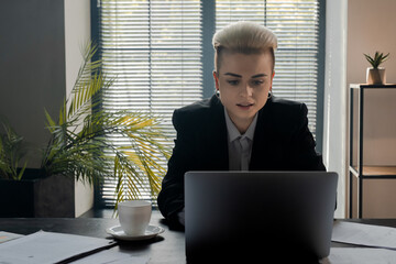 Shot of remote employee girl speaking on video conference. Startuper businesswoman using laptop call investors to explain details. Seo manager woman dressed suit for distance interview