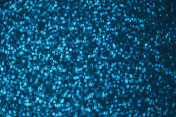 Shiny blurry blue background. Festive texture with bokeh.