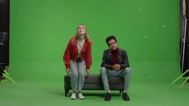 GREEN SCREEN Multi-racial couple pretending they are visiting a museum or art exhibition 