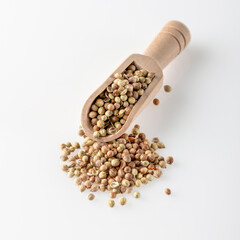 Coriander lies in a wooden scoop..Aromatic coriander used for cooking. Cooking spice.