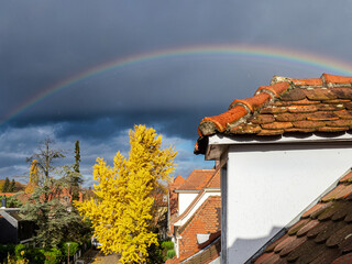 Rainbow after autumn rain over the old quarter of Strasbourg. - 679625163
