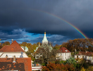 Rainbow after autumn rain over the old quarter of Strasbourg. - 679625191