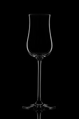Empty glass wine glass on a black background..Wine glass for a drink on a black background. White silhouette of a glass.