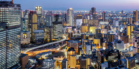 Osaka big city lights from above skyline with skyscraper panorama at twilight in Japan