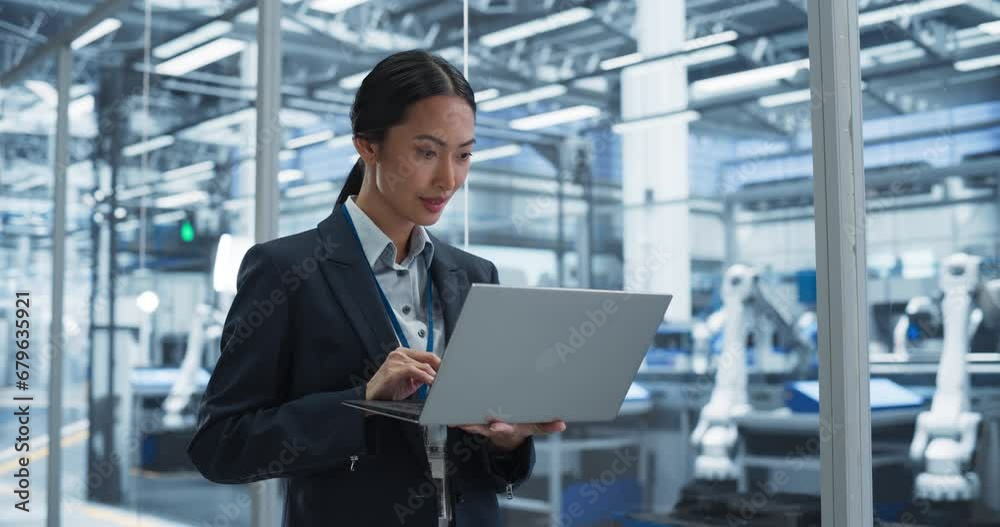 Poster Thoughtful Asian Engineer Monitoring and Analyzing Conditions at a Pristine Modern Electronics Factory with Automated Robot Hands Working with the Help of Artificial Intelligence Software