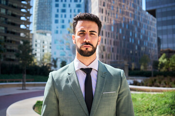 Portrait of young adult Caucasian handsome business man serious expression. Finance male in formal...
