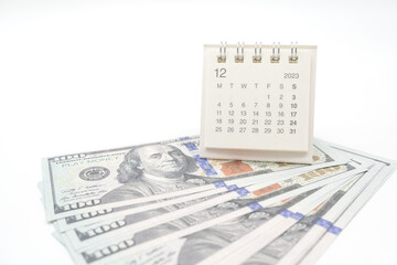 Obraz premium Envelope With Money And Calendar. opens envelope with money, dollars. Pension Concept. Bonus Money. isolated on white background.
