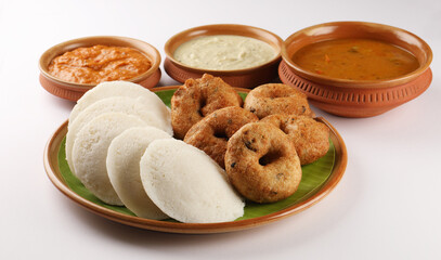 food South Indian food idli vada with sambar on a banana leaf