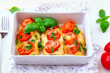 Chicken fillets baked with mozzarella, tomatoes and basil