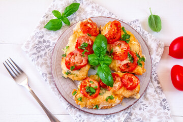 Chicken fillets baked with mozzarella, tomatoes and basil