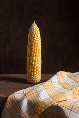 Sweet corn on wooden background..