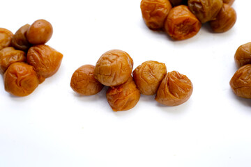 Pickled plums on white background.