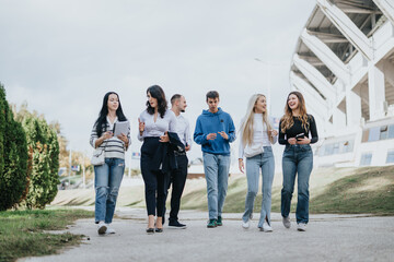 Fototapeta premium Successful Students Collaborating on University Project in Sunny Park