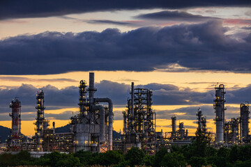 Fototapeta na wymiar Oil​ refinery​ plant and tower of Petrochemistry industry in oil​ and​ gas​ ​industry with​ cloud​ blue​ ​sky