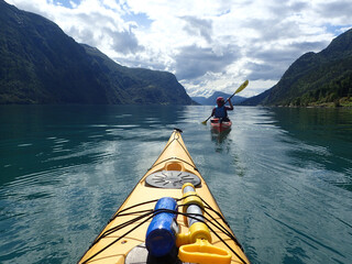 Sea kayaking in Norwegian fjord. Summer.