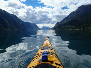 Sea kayaking in Norwegian fjord. Summer.