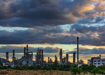 Obraz premium Oil​ refinery​ plant and tower of Petrochemistry industry in oil​ and​ gas​ ​industry with​ cloud​ blue​ ​sky
