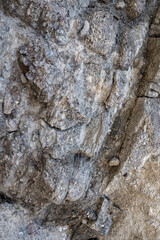 Texture cracked rock formation rock in the wild. Rocky cliff. Abstract Stone texture. Steep cliff of high mountain. Nature background, geological structure. 