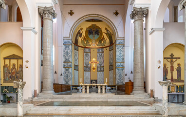 View of altar between two roman columns inside italian catholic church
