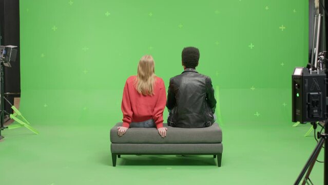 GREEN SCREEN Multi-racial couple pretending they are visiting a museum or art exhibition 