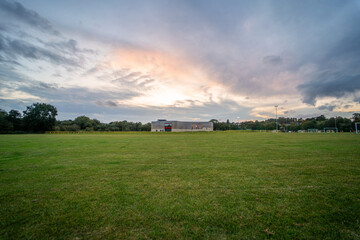 Large empty camping area in England during sunset - obrazy, fototapety, plakaty