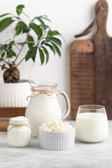 Obraz na płótnie Canvas Glass of milk, jug of milk, dairy products, calcium rich foods