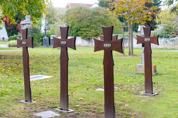 old iron grave crosses in cemetery, funeral 2023, beginning something important, end bad period life, Background for design, copy space