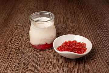 Jar of Greek yogurt with strawberry jam