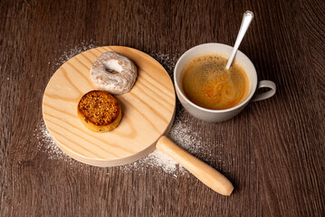 Breakfast or snack with shortbread and coffee on wooden background