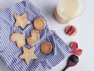  homemade shortbread cookies with different shapes and rustic background