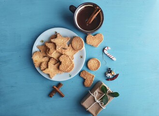  christmas homemade shortbread cookies with different shapes and  blue background