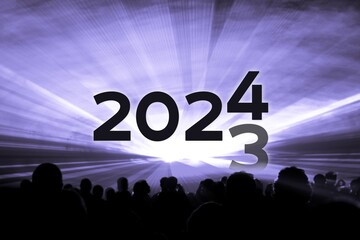 Turn of the year 2023 2024 purple laser show party. Luxury entertainment with people crowd audience silhouettes at new year celebration. Premium nightlife event at holidays season time