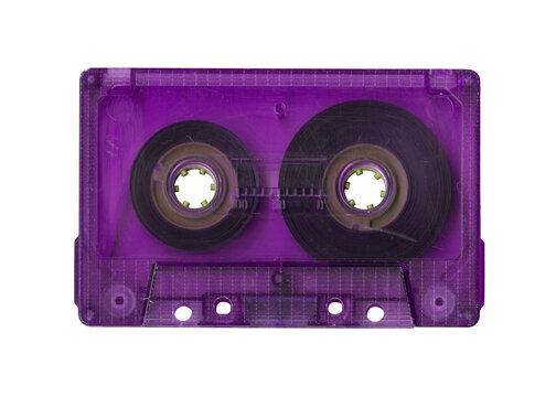 Vintage purple audio cassette tape isolated. Obsolete technology of audio recording and playback format audio cassette tapes, top view. 80s retro music background.