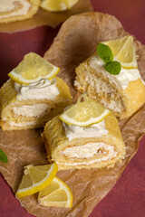 Lemon roll with fruit curd, with mint, close-up