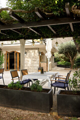 A set table and chairs on the summer veranda of a cafes without people